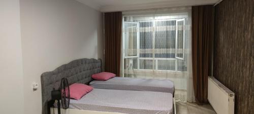 En eller flere senger på et rom på Midtown Hotel Apartments 303 ( 2+1)