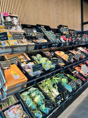 a produce section of a store with different types of food at Motel Inn Simbach in Simbach am Inn