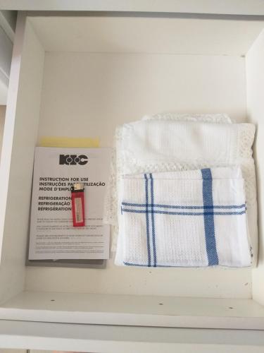 two towels and a book in a drawer at Prince Alfreds in Caledon