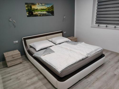Кровать или кровати в номере Dom gościnny 4JAWA I