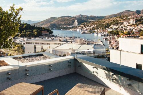 a view from the roof of a building overlooking a harbor at City Hotel Dubrovnik in Dubrovnik