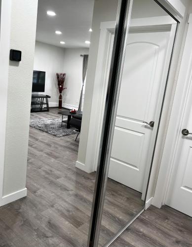 a hallway with a door and a living room at Anchorage midtown apartment- Wyoming 1 in Anchorage