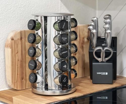 a bunch of wine bottles on a wooden shelf at Anchorage midtown apartment- Wyoming 1 in Anchorage