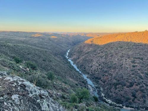a view of a valley with a river on a hill at Casa da Aldeia in Azevo