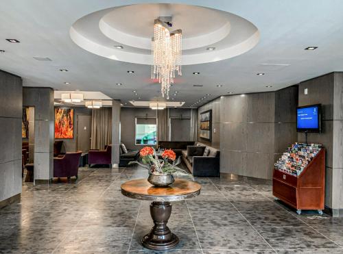 a lobby with a vase of flowers on a table at Outstanding Mountain Condo WATERSLIDE and HOT TUB managed by Little Sister Getaways in Canmore
