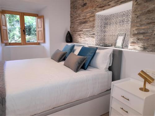 Postel nebo postele na pokoji v ubytování Apartamento con encanto en centro histórico Lugo -TineriaLucusHome