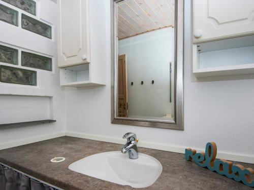 a bathroom sink with a mirror on a counter at 6 person holiday home in Struer-By Traum in Struer