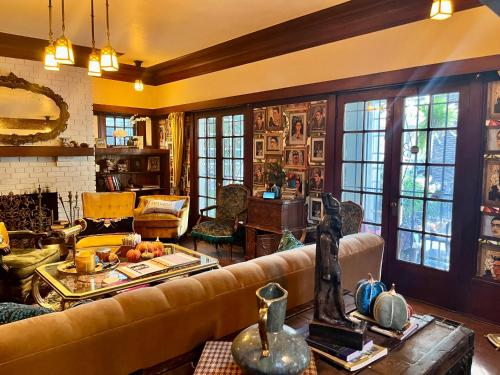 a living room with a couch and a table at Harbinson House in Sacramento