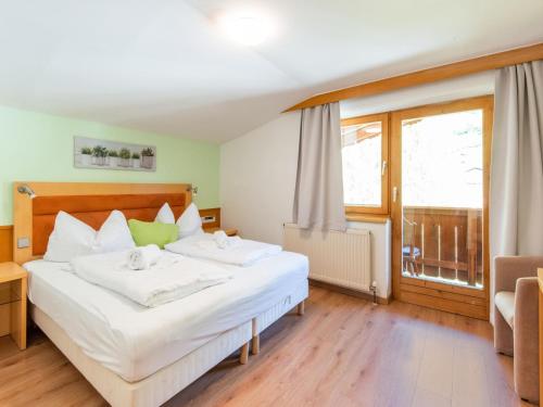 a bedroom with a bed and a large window at Chalet in Oberau near Ski Slopes in Oberau