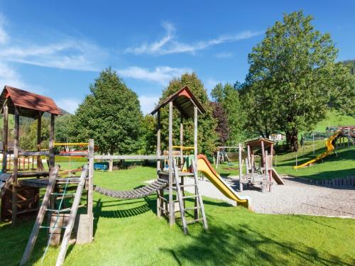 a playground in a park with slides and swings at Chalet in Oberau near Ski Slopes in Oberau