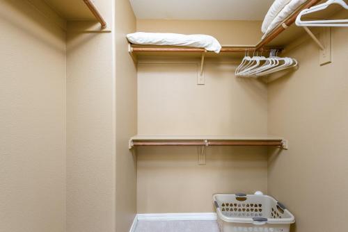 a walk in closet with a toilet and towels at Scottsdale Condo in Scottsdale