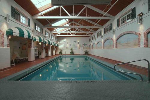 a large indoor swimming pool in a building at Seaview, A Dolce Hotel in Galloway