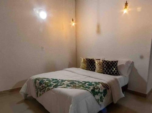 Un pat sau paturi într-o cameră la Vamos para Bello Antioquia