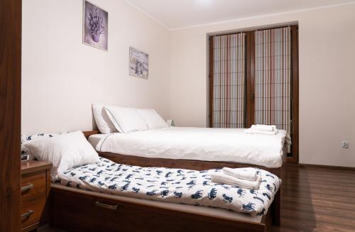Cama o camas de una habitación en Dom Wypoczynkowy - Alexander