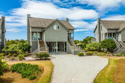a large house with a driveway at Beach Blessings in Topsail Beach