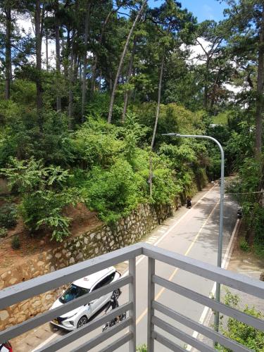 a car parked on the side of a road at Sơn Hùng Hotel Đà Lạt in Da Lat