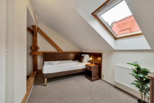 Un pat sau paturi într-o cameră la Rezidence Villa Gloria
