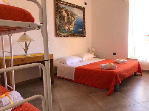 a bedroom with a bed and a bunk bed at La Casa di Antonella in Agrigento