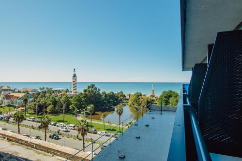 a view of a city from the balcony of a building at Batumi River Source in Batumi