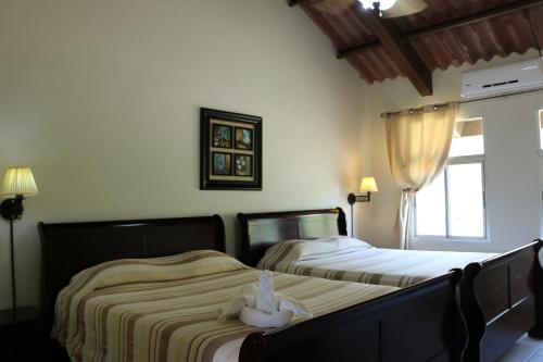 Cama o camas de una habitación en Hotel Campestre