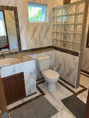 a bathroom with a toilet and a sink at Hua Hin in Hua Hin