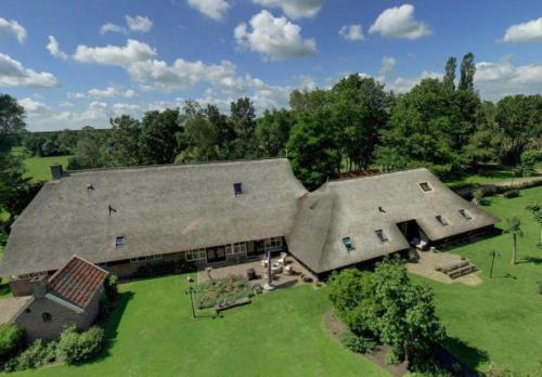 an overhead view of a large house with a yard at De Zilveren Maan in Balkbrug