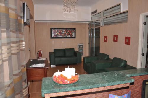 a living room with a couch and a table at Hotel Fontana Del Re in Ariano Irpino