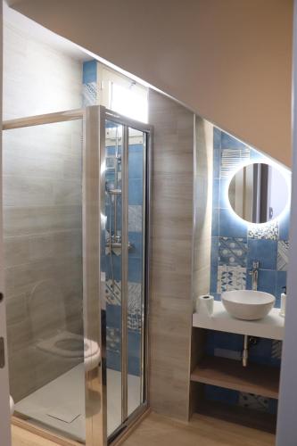 a bathroom with a shower and a sink at Pescoluse Apartments in Marina di Pescoluse