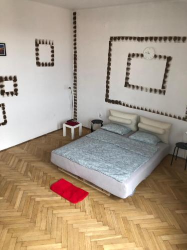 a bedroom with a bed and a mirror on the wall at Pokój 11A in Krakow