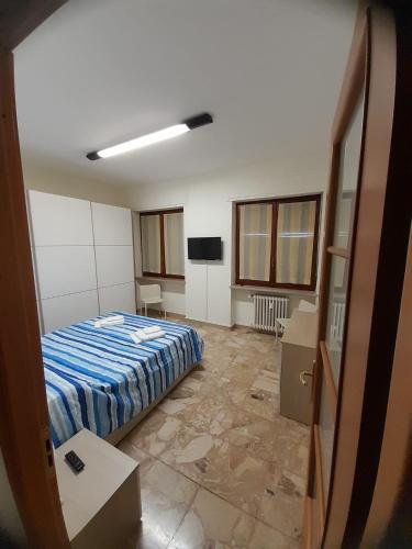 Postel nebo postele na pokoji v ubytování VERCELLI CENTRO