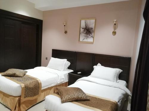 Ένα ή περισσότερα κρεβάτια σε δωμάτιο στο Rahhal Hotel Suites