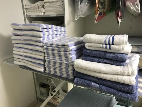 a pile of towels on a rack in a room at Villa "La vie est belle...!" in Cavalaire-sur-Mer