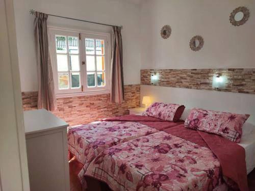 Postel nebo postele na pokoji v ubytování Bungalow Santa Fe en Playa del Inglés