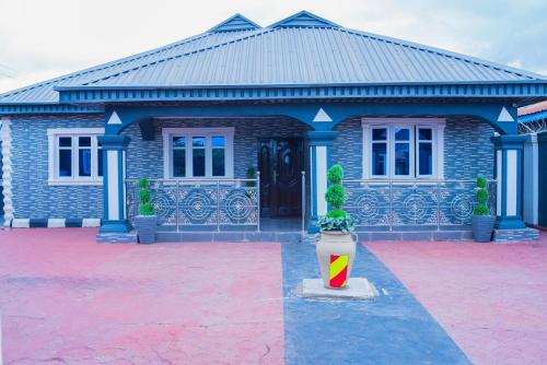 a building with a fire hydrant in front of it at 3 Bedrooms house for Short let Holiday Apartments in Ibadan