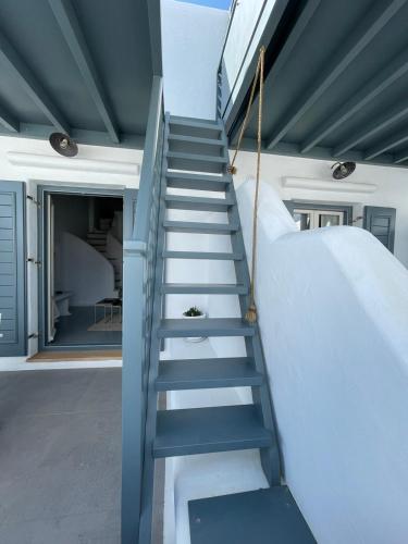 a staircase leading up to a house at 5 Traditional Suites in Livadi Astypalaias