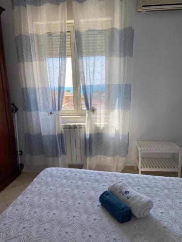 Una cama o camas en una habitación de La Terrazza di Pollon