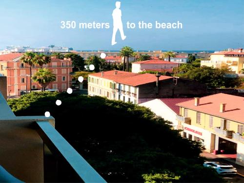 a poster of a person walking to the beach at Cozy studio apartment in Cannes - AC-Self check-in in Cannes