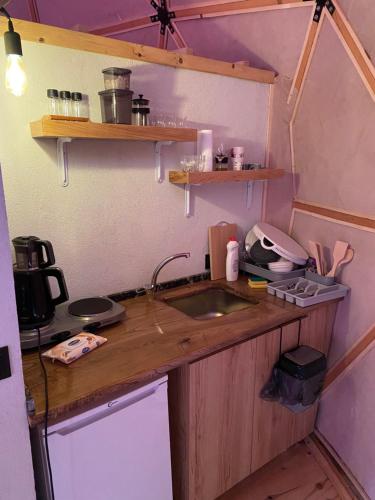 a kitchen with a sink and a counter top at North Dome & Suite in Rize