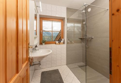 a bathroom with a sink and a shower at Haus Steirerland in Schladming