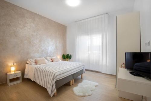 A bed or beds in a room at Appartamento Carducci Fiera Rho Milan