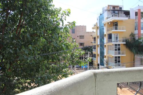 a city street with a building and trees at Social Rehab in Bangalore