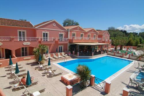 an image of a swimming pool at a resort at Joy Hotel in Sidari