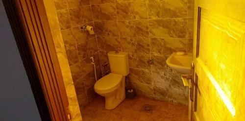 a bathroom with a toilet and a sink at Hayaat siwa hot spring in Siwa
