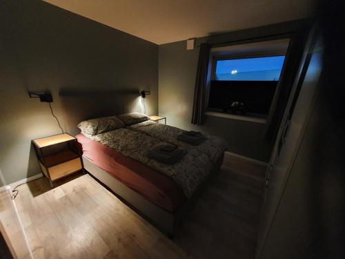 Postel nebo postele na pokoji v ubytování Åsveien Apartments.
