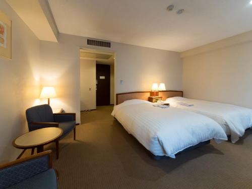 Postel nebo postele na pokoji v ubytování Hotel Matsunoka Ichinoseki