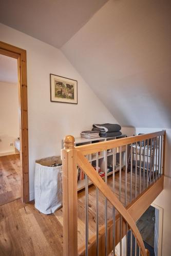 a staircase in a room with a stair case at Ferienhaus Asten-Lodge in Winterberg