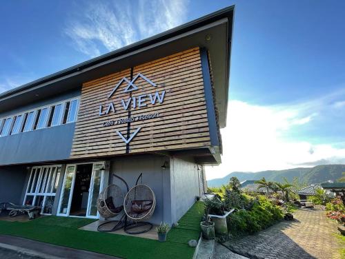a large sign on the side of a building at La View Mountain Resort in Damasanan