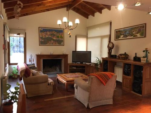 TV a/nebo společenská místnost v ubytování Casa Radal