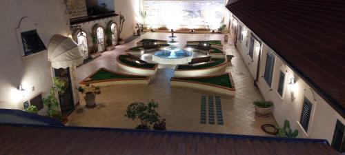 an overhead view of a building with a fountain at Hotel Trinacria in Palermo