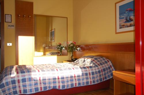 Postel nebo postele na pokoji v ubytování Albergo Ristorante Del Ponte